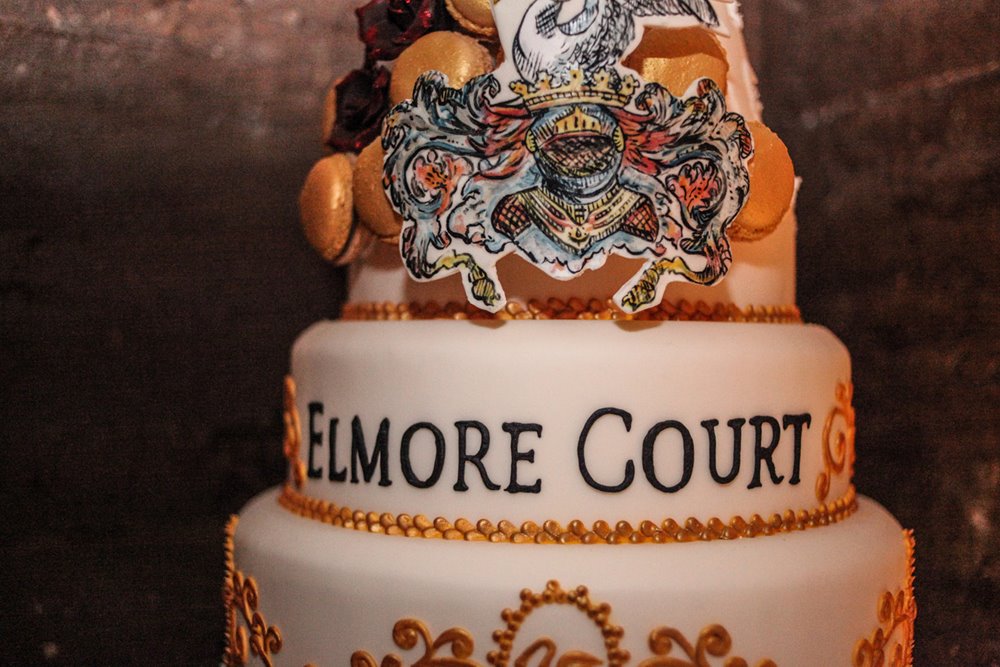 Amazing macaroon tower cake with elmore court family crest and logo on it for launch party of wedding venue in 2013