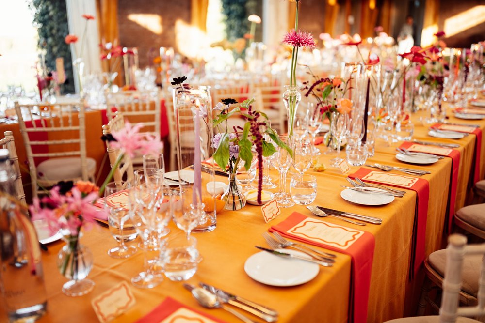 Colourful wedding flowers on bright tables for party wedding
