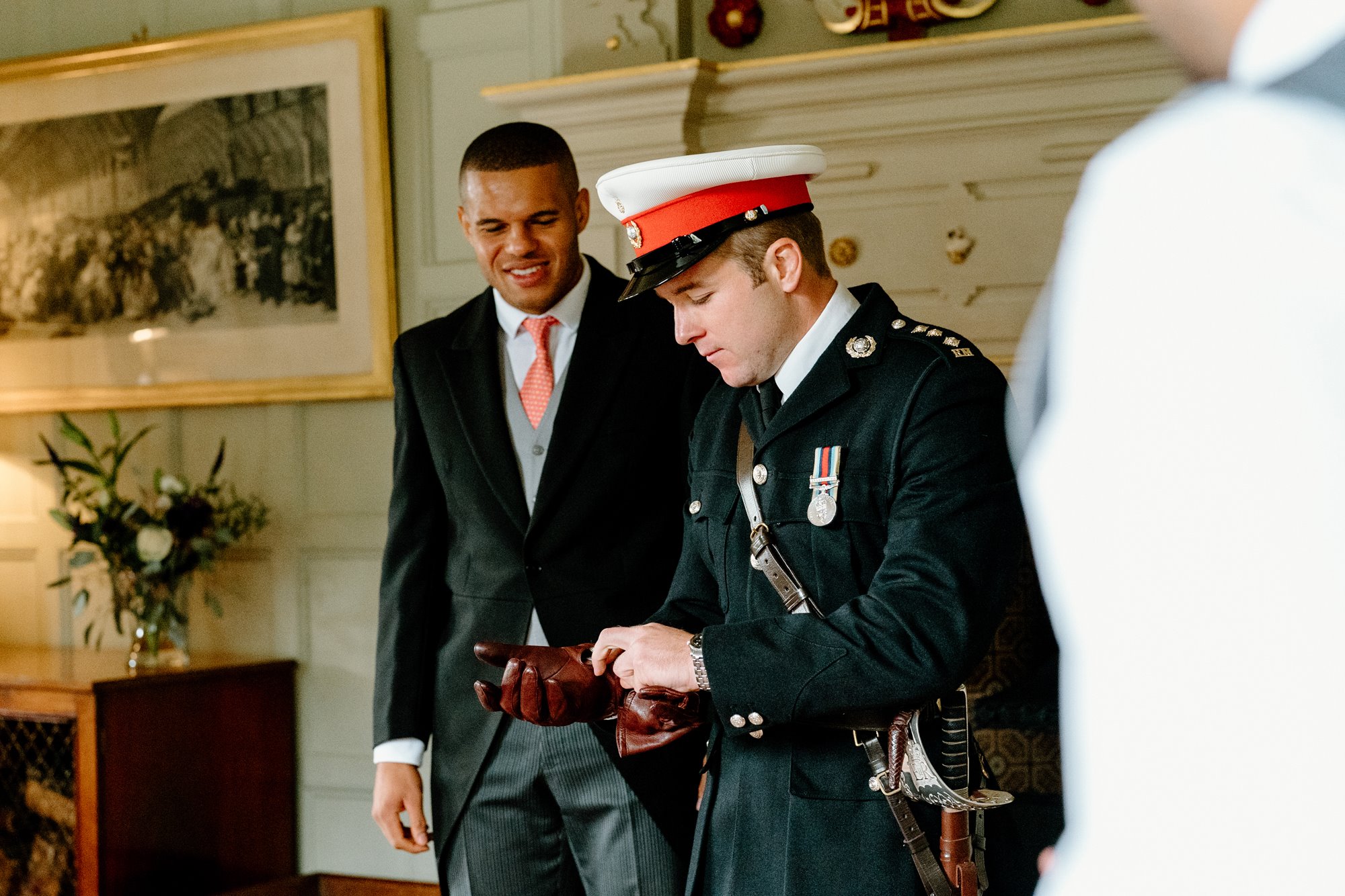 handsome groom wearing his military uniform while he waits to get married at a Gloucestershire wedding venue