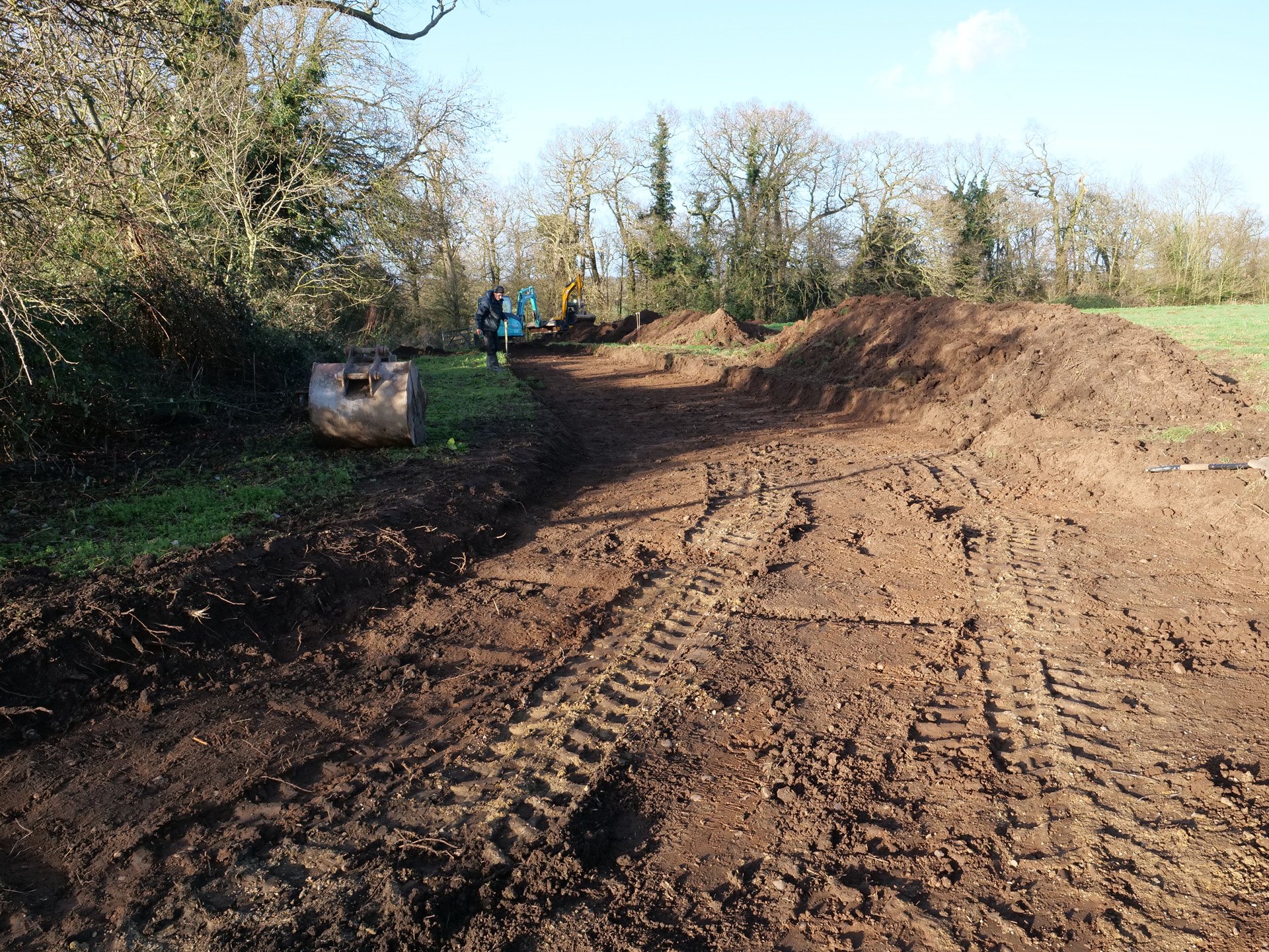 muddy fields being dug to start woodland cabin build for treehouse holidays at elmore court in the cotswolds