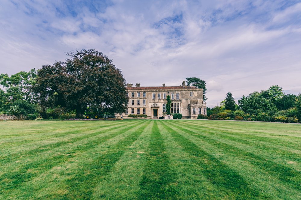 Mansions house wedding venue with beautiful striped lawn in gloucestershire