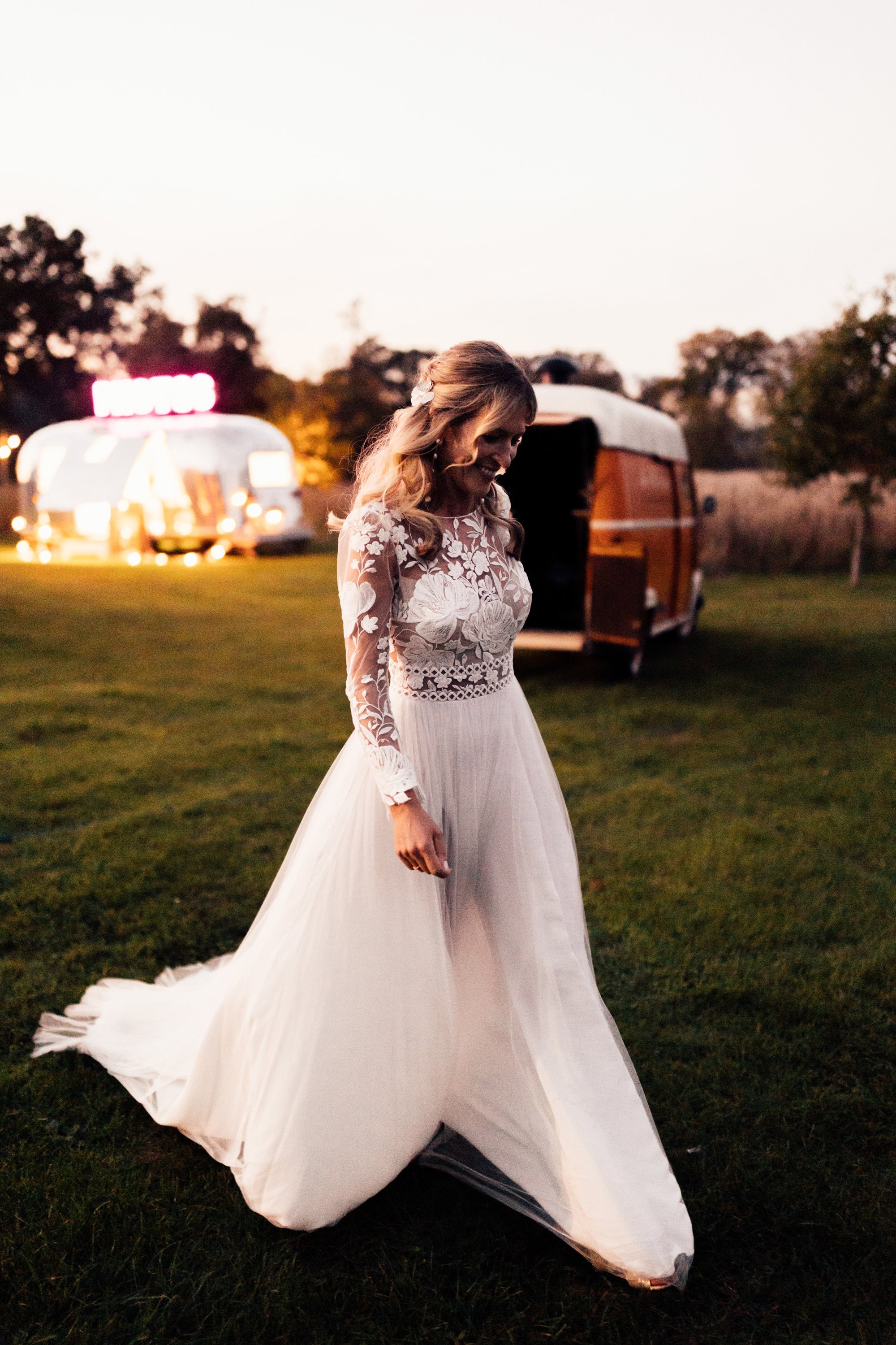 bride at her festival style wedding with a white lace dress