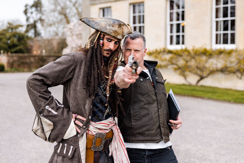 Anselm Guise pointing gun to the camera with Johnny depp pirates of the carribean