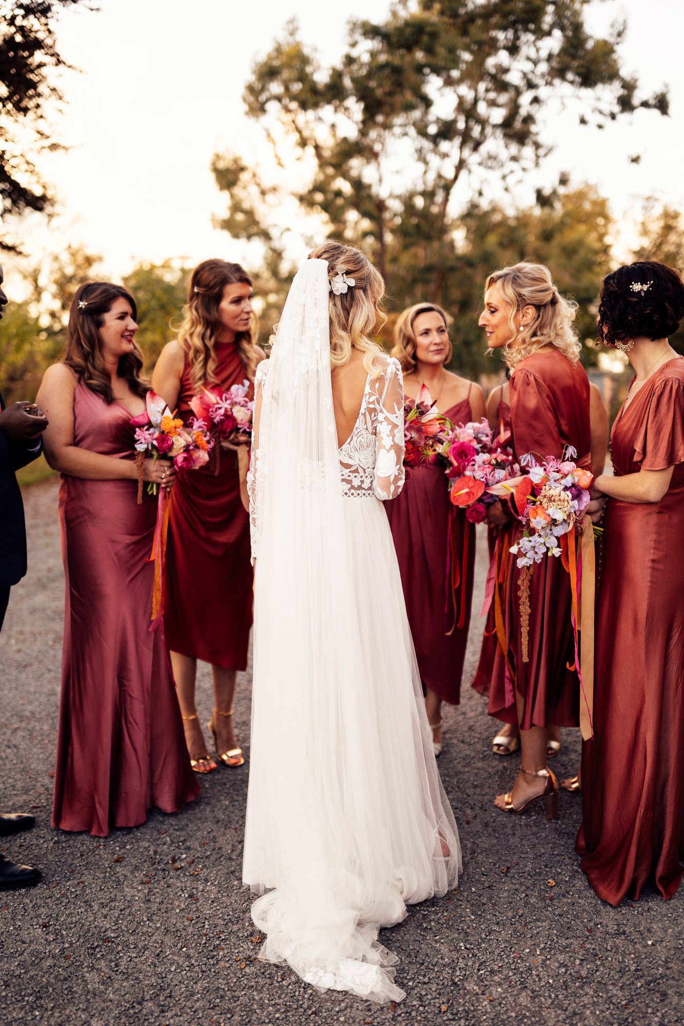 colourful bridesmaids with bright flowers