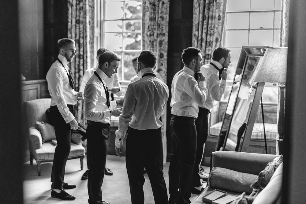 Groomsmen getting ready for the big gay wedding day at Cotswolds mansion house