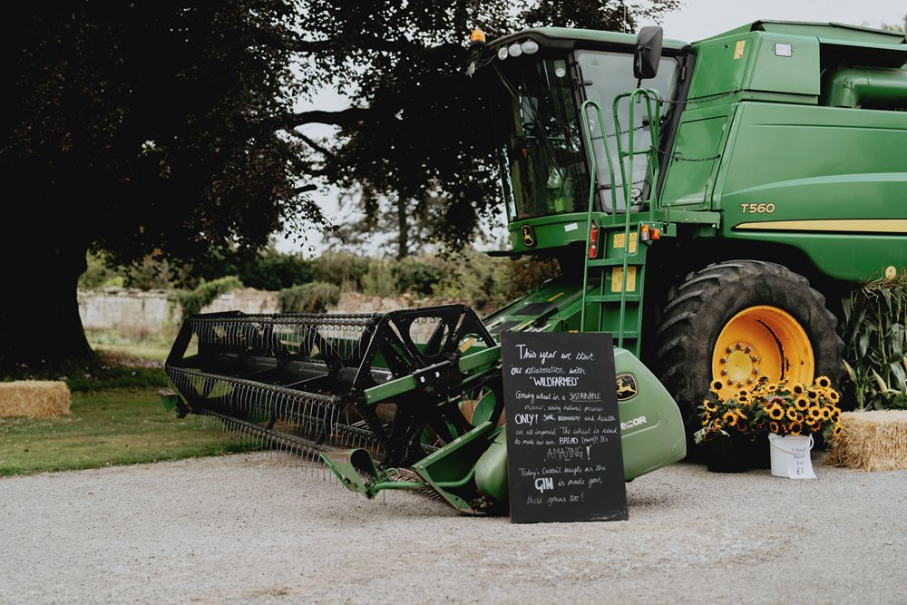 Combine harvester at wild farm wedding venue with climate positive food and drink