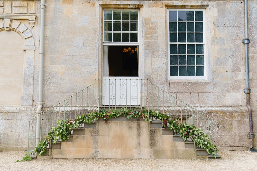 Wedding steps decorated with greenery at stately home elmore court
