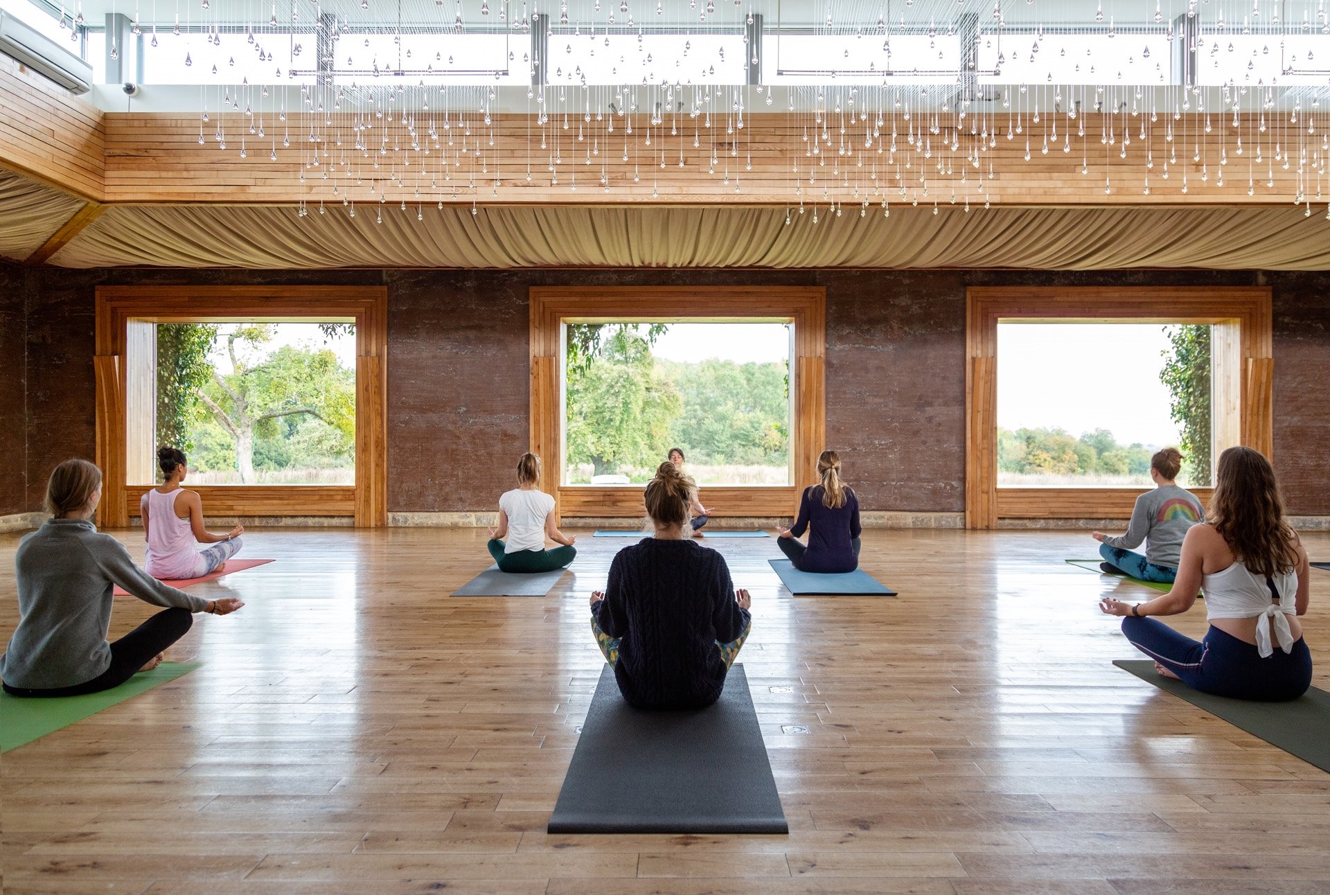 Yoga class in the gillyflower at sustainable venue elmore court as part of their rewild retreats