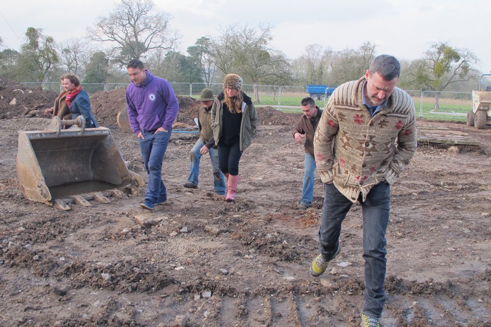 Anselm Guise and Team E tread earth down flat for the laying of the foundations of the eco build wedding reception and party venue the gillyflower in 2013 at elmore court