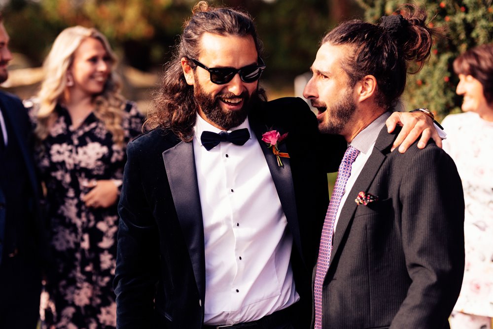 cool groom outside wedding ceremony