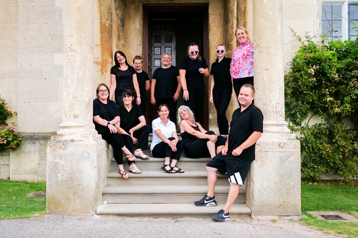 meet the team at elmore court stately home wedding venue - here are the housekeeping team on the steps