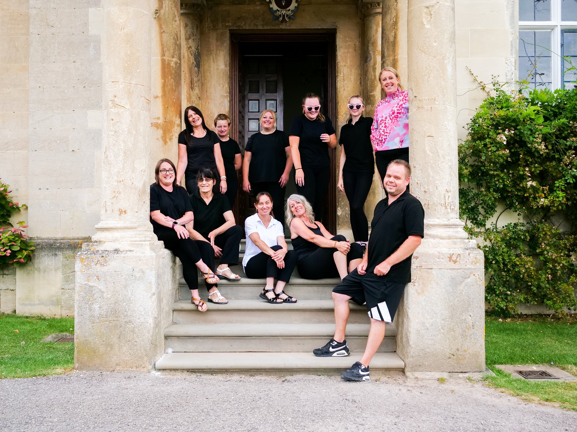 meet the team at elmore court stately home wedding venue - here are the housekeeping team on the steps
