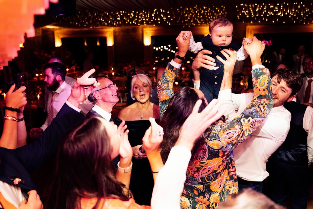 Fun couple throw an epic party wedding in a soundproof venue in the cotswolds