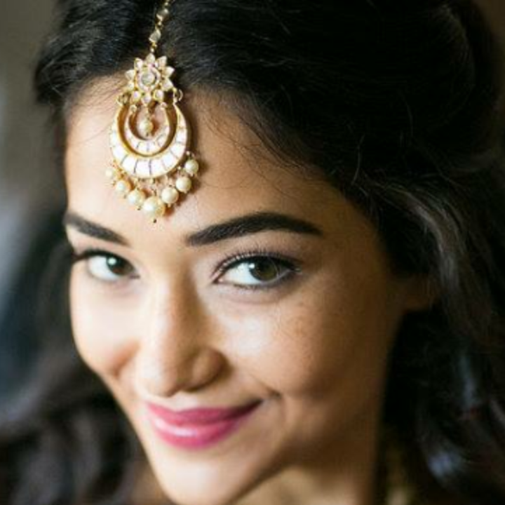 Beautiful Indian bride with stunning wedding makeup and hair at Elmore Court