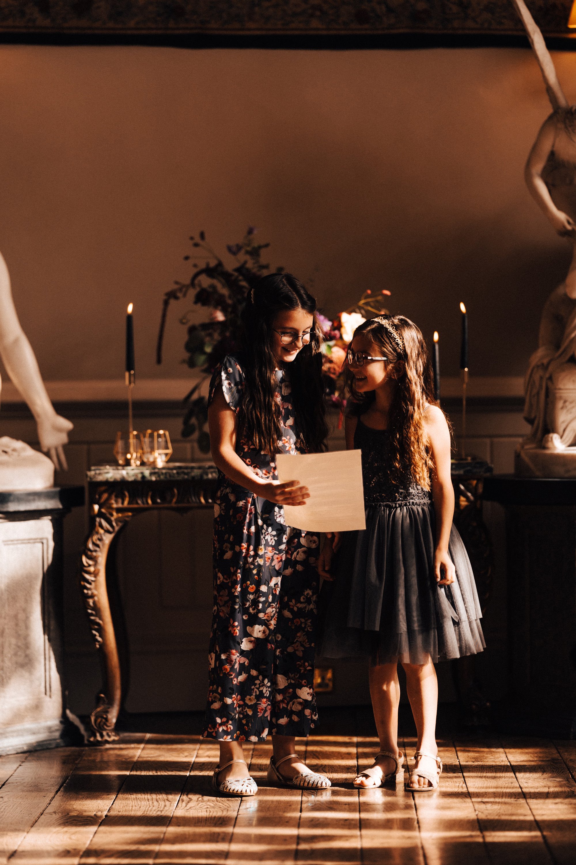Children taking part in readings during wedding ceremony at a stately home in gloucester