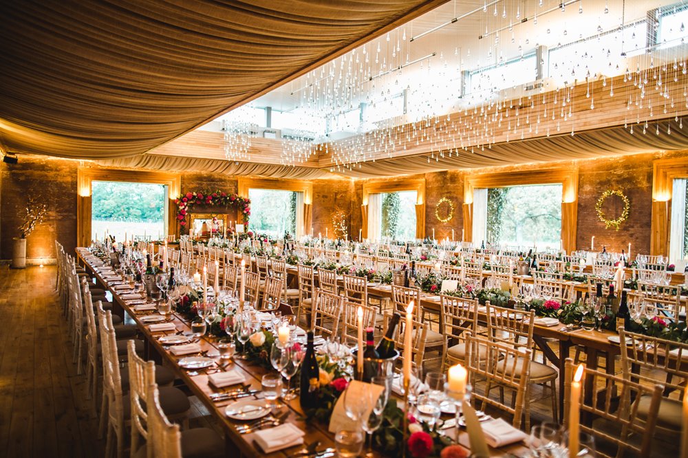 autumn wedding banquet with candles and roses at elmore court