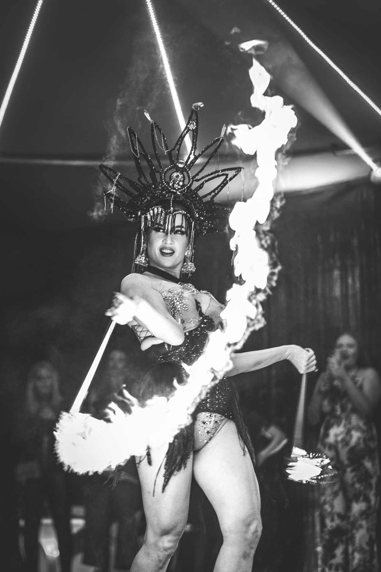 Burlesque fire performance by Missy fatale of The Parrot Cage returns to Elmore for staff Christmas party