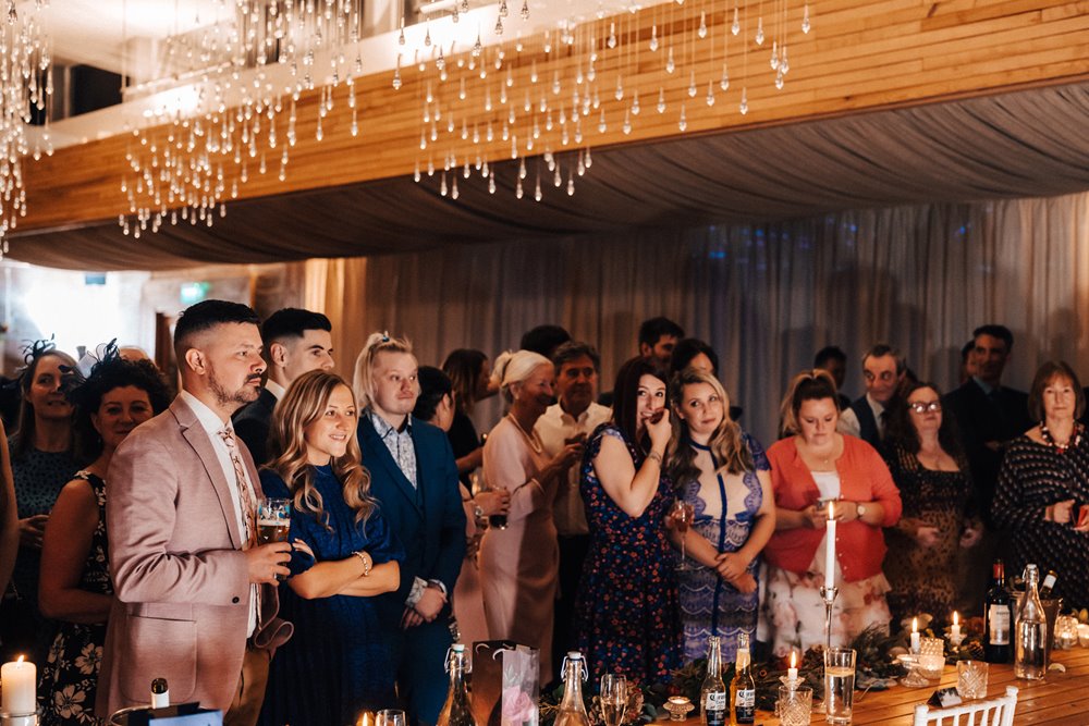 guests watch first dance at magical wedding reception