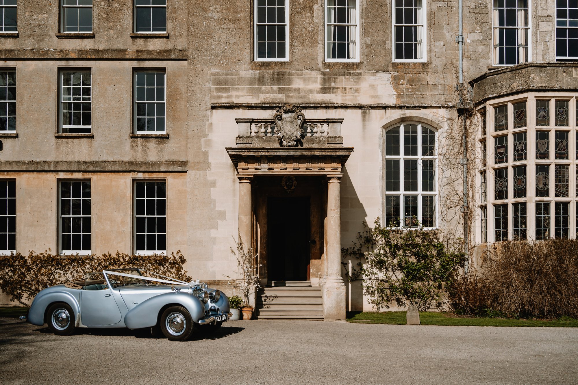 Classic car at Elmore Court, a stately home and wedding venue in the Cotswolds