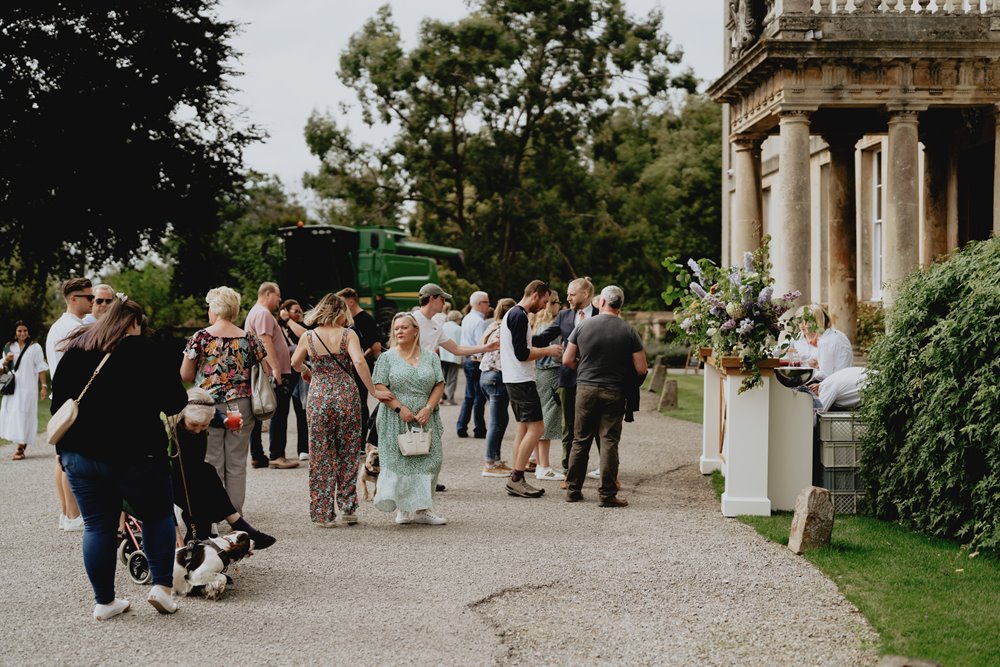 Guests arrive for wild wedding fair at sustainable wedding venue elmore court in Gloucestershire
