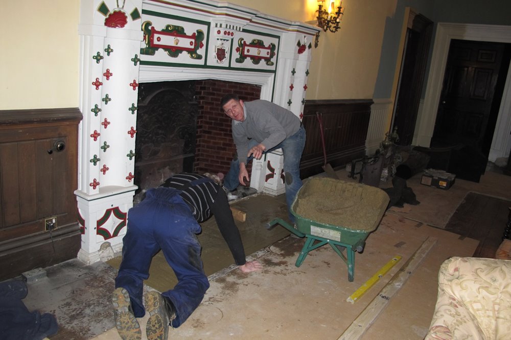 Historic fireplace in Mansion house elmore court amidst building works in the lead up to opening for wedding and events in 2013