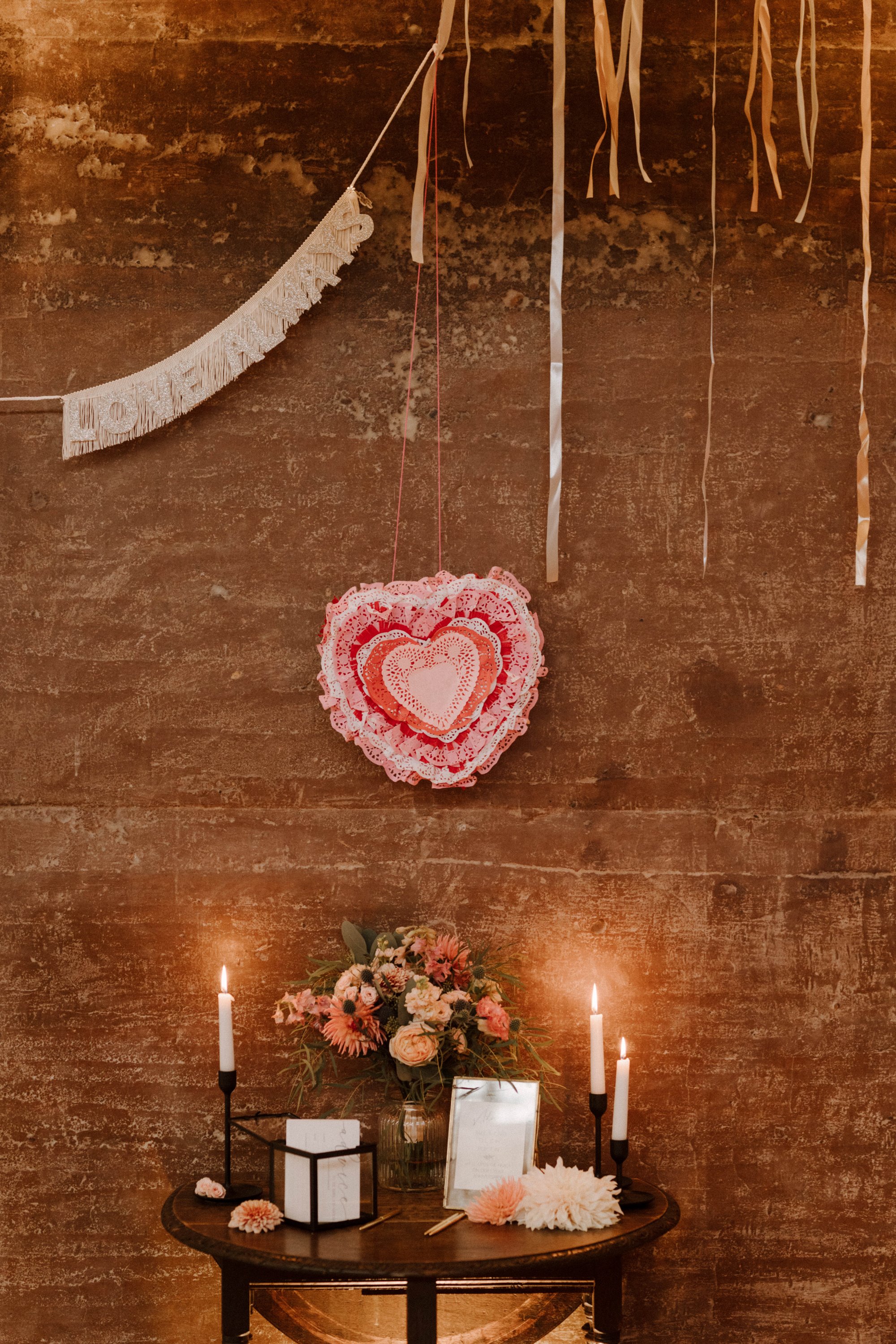 simple display with a heart and flowers at a wedding ceremony at Elmore Court