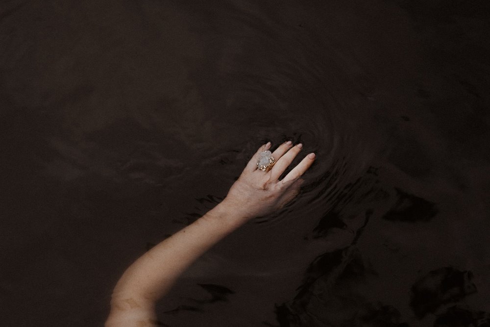 Luxe wedding inspiration wild swimming bride wearing uncut wedding ring with rough stones