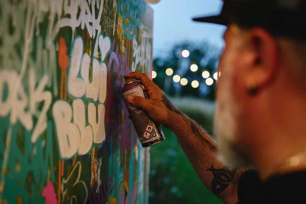 Live graffiti art wedding outdoors at elmore court