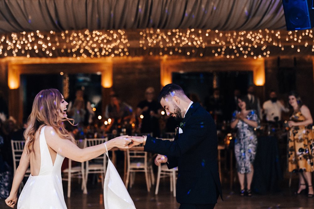 starry night vibes for this rockstar couples first dance at soundproof eco wedding reception venue in the gloucestershire countryside