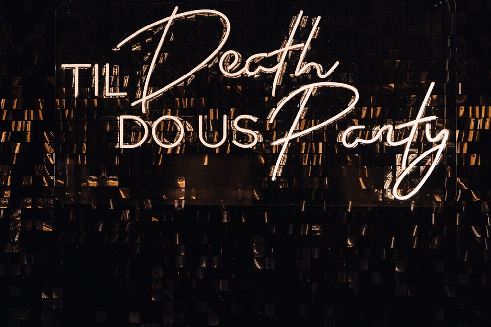 Till death do us party sign for a black and gold wedding with dark and moody vibes in gloucestershire