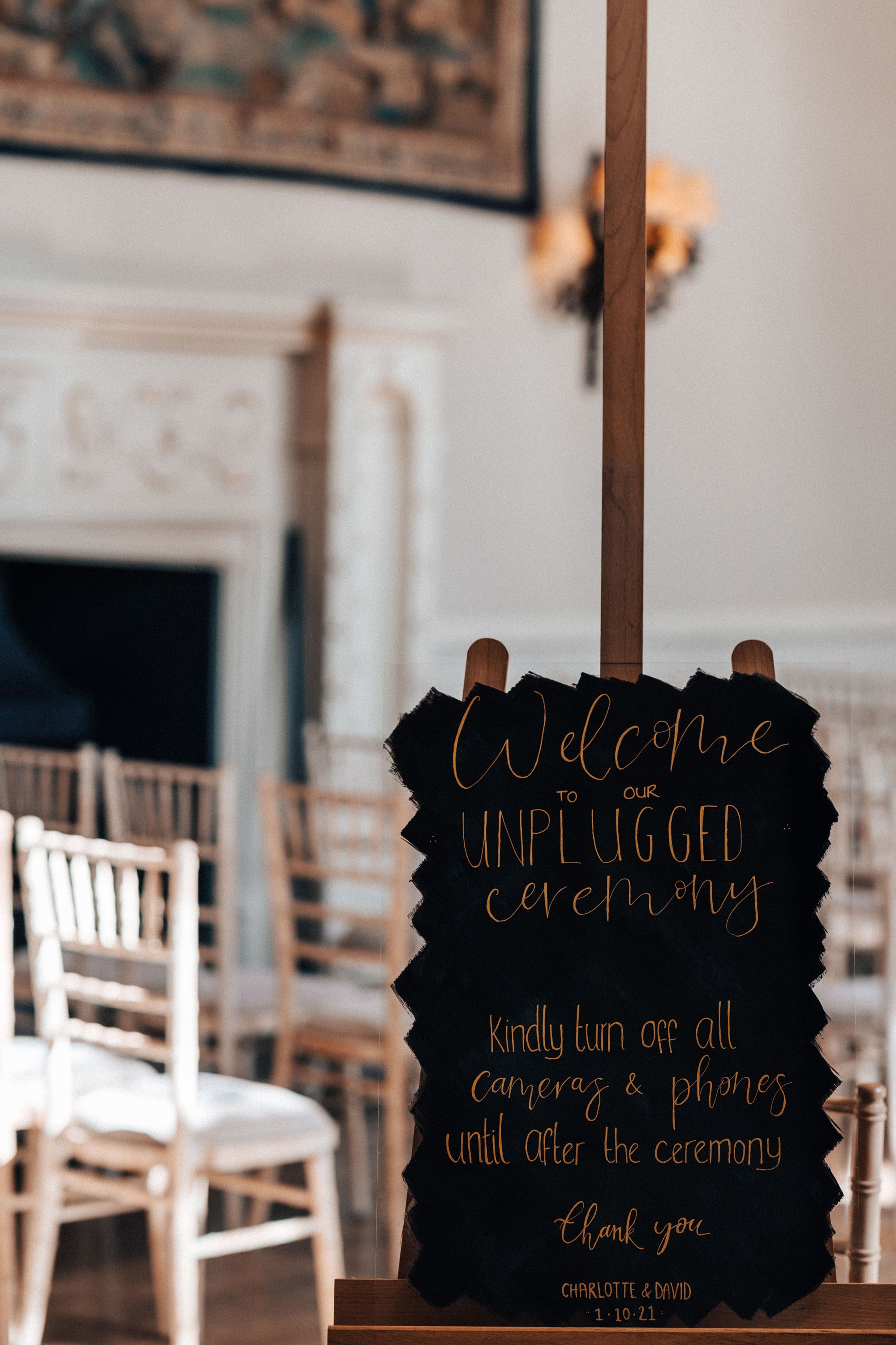 Bride made DIY wedding signs for her black and gold autumn wedding in a stately home in gloucestershire