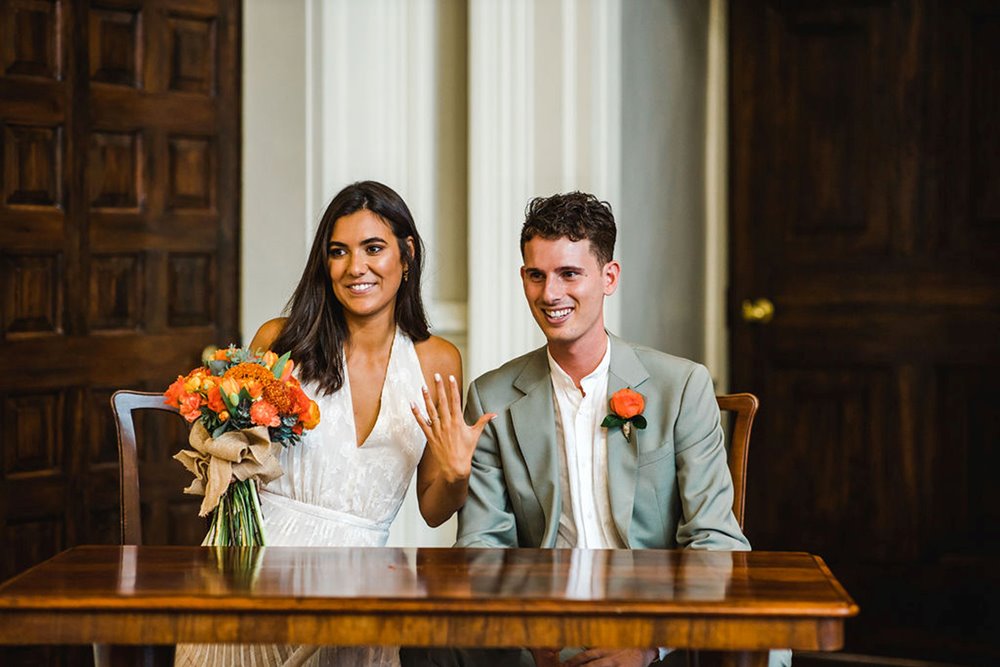 Happily married couple at their micro wedding ceremony