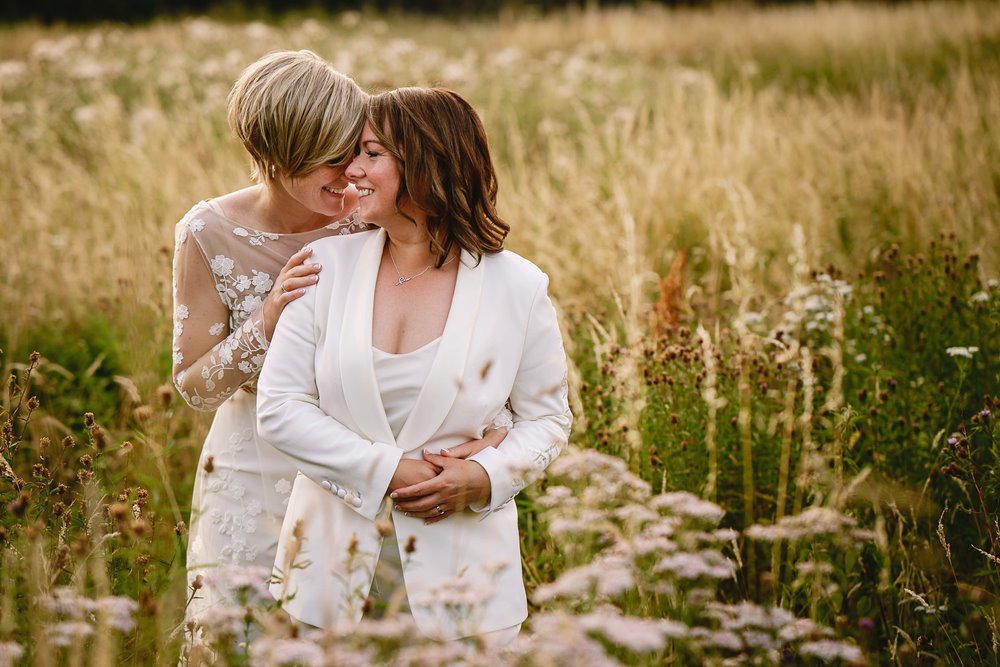 Special moment with two brides in golden fields