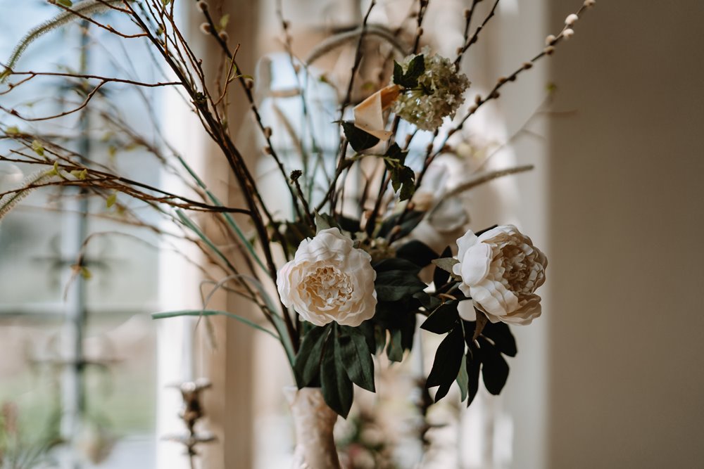 rustic wedding flowers on a table display at a wedding ceremony