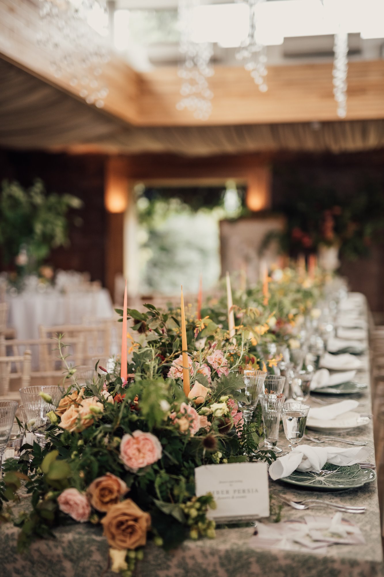 September florals on long tables in sustainable wedding reception the gillyflower