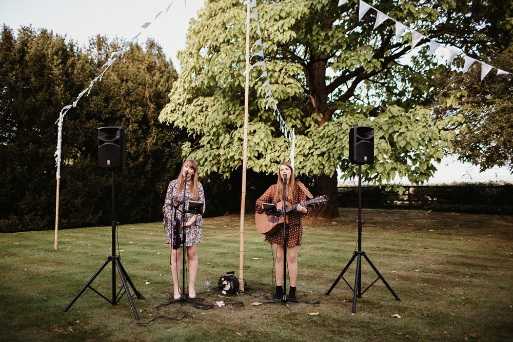 duo playing outside at an outdoor wedding at elmore court