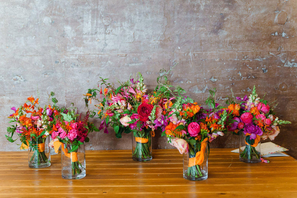 Brightly coloured summer wedding inspiration: hot pink and orange bouquets
