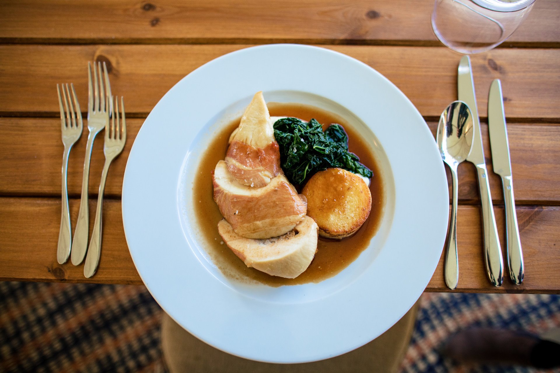 Chicken breast wrapped in parma ham, pork and cranberry stuffing, cavil nero, cauliflower puree, fondant potato and madeira jus (from our winter menu)