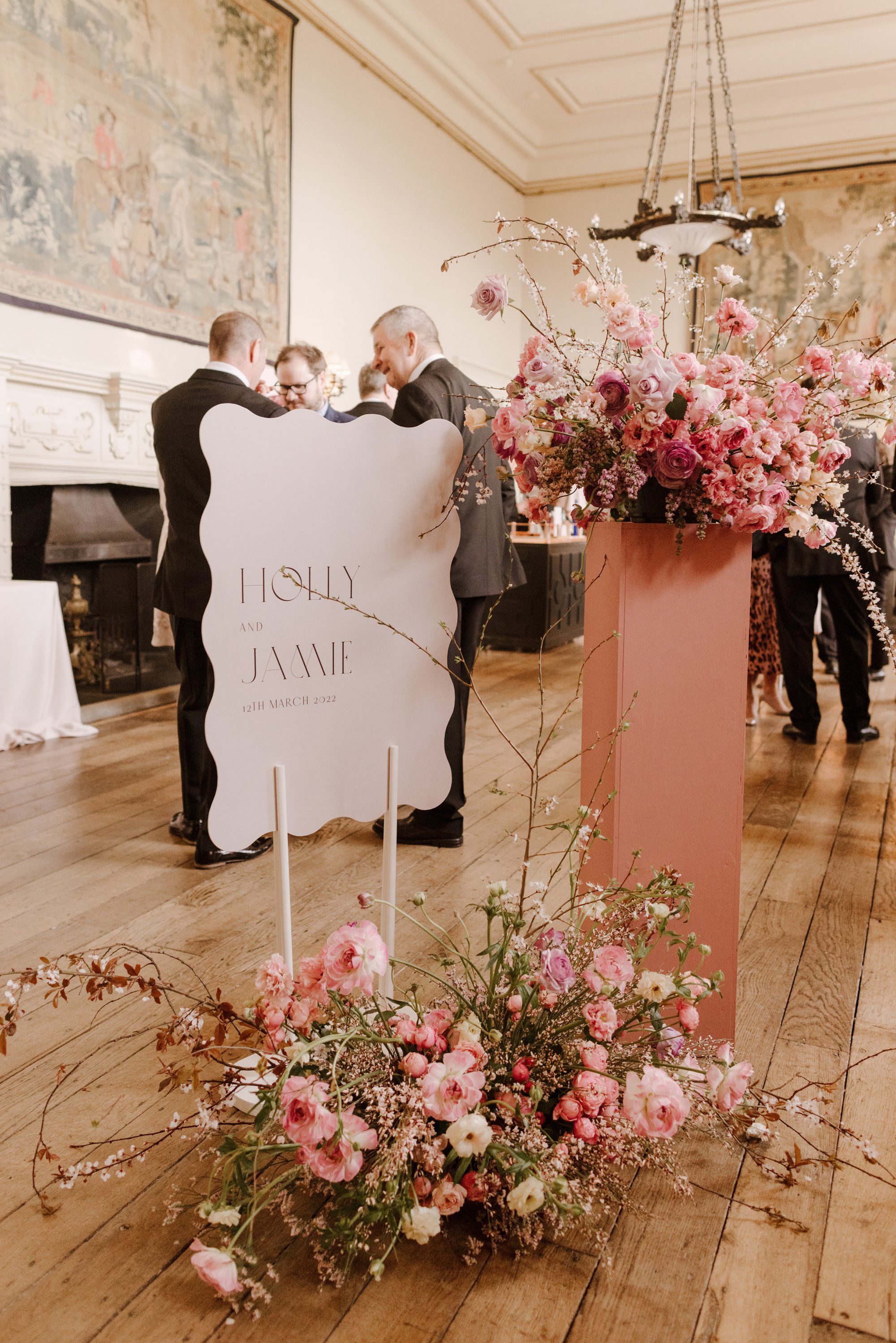 pink flower welcome display at a wedding ceremony in a stately home