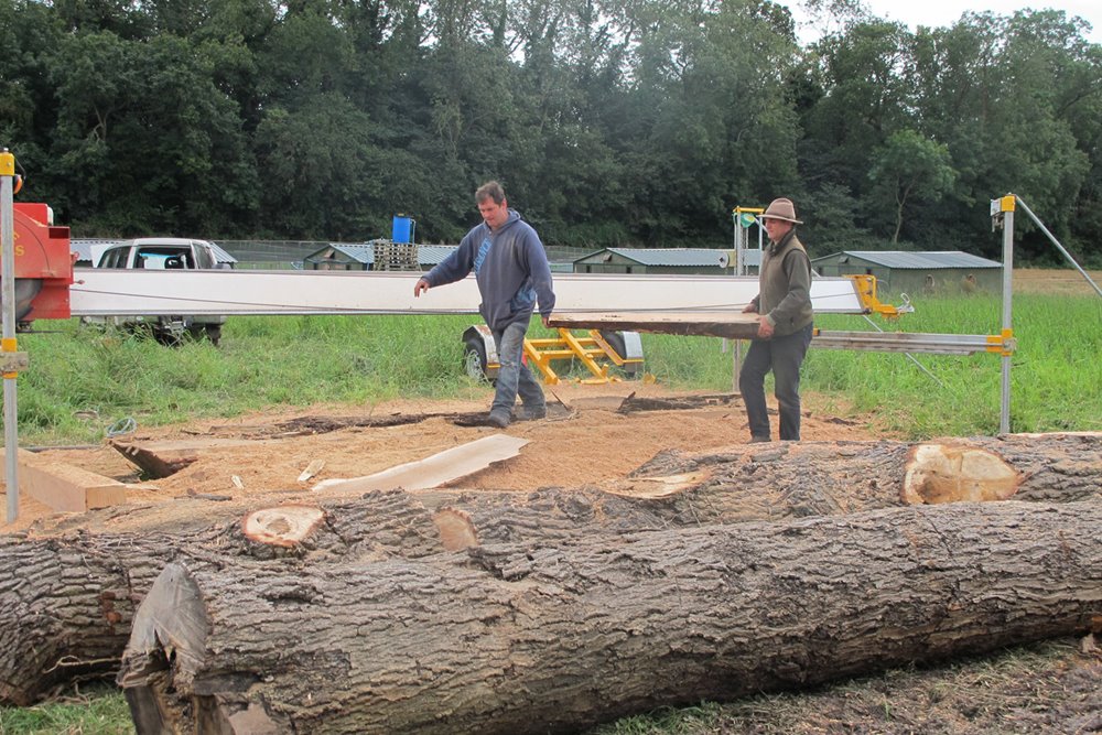 Building eco wedding reception the Gillyflower, cutting and planing timber from the estate at elmore court
