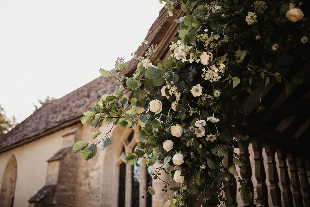 pretty church entrance greenery for wedding