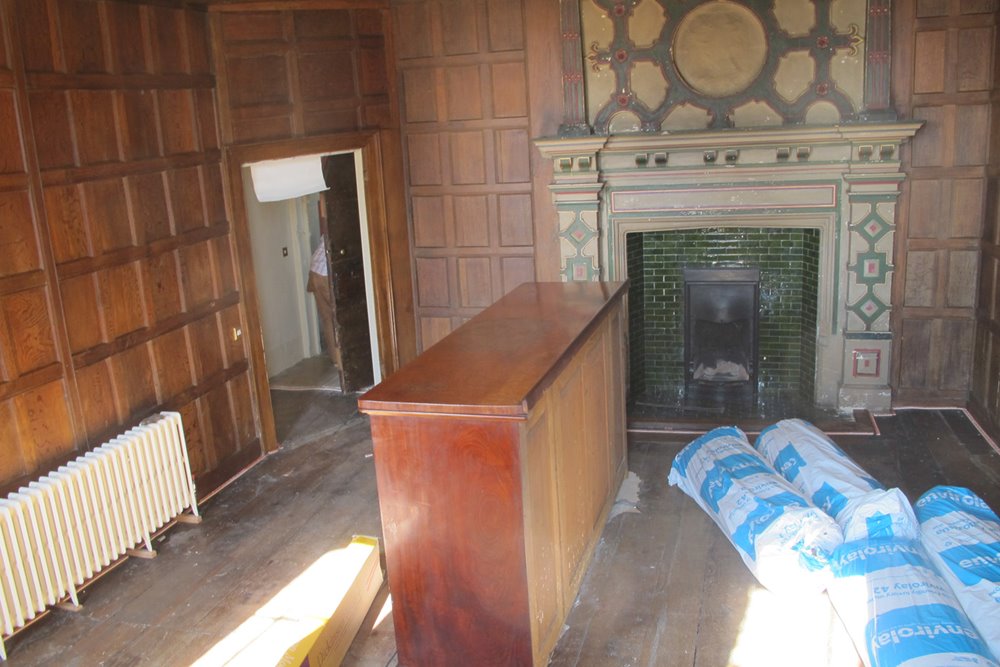 Historic wood paneled room in Mansion house elmore court amidst refurbishment and building works in the lead up to opening for wedding and events in 2013