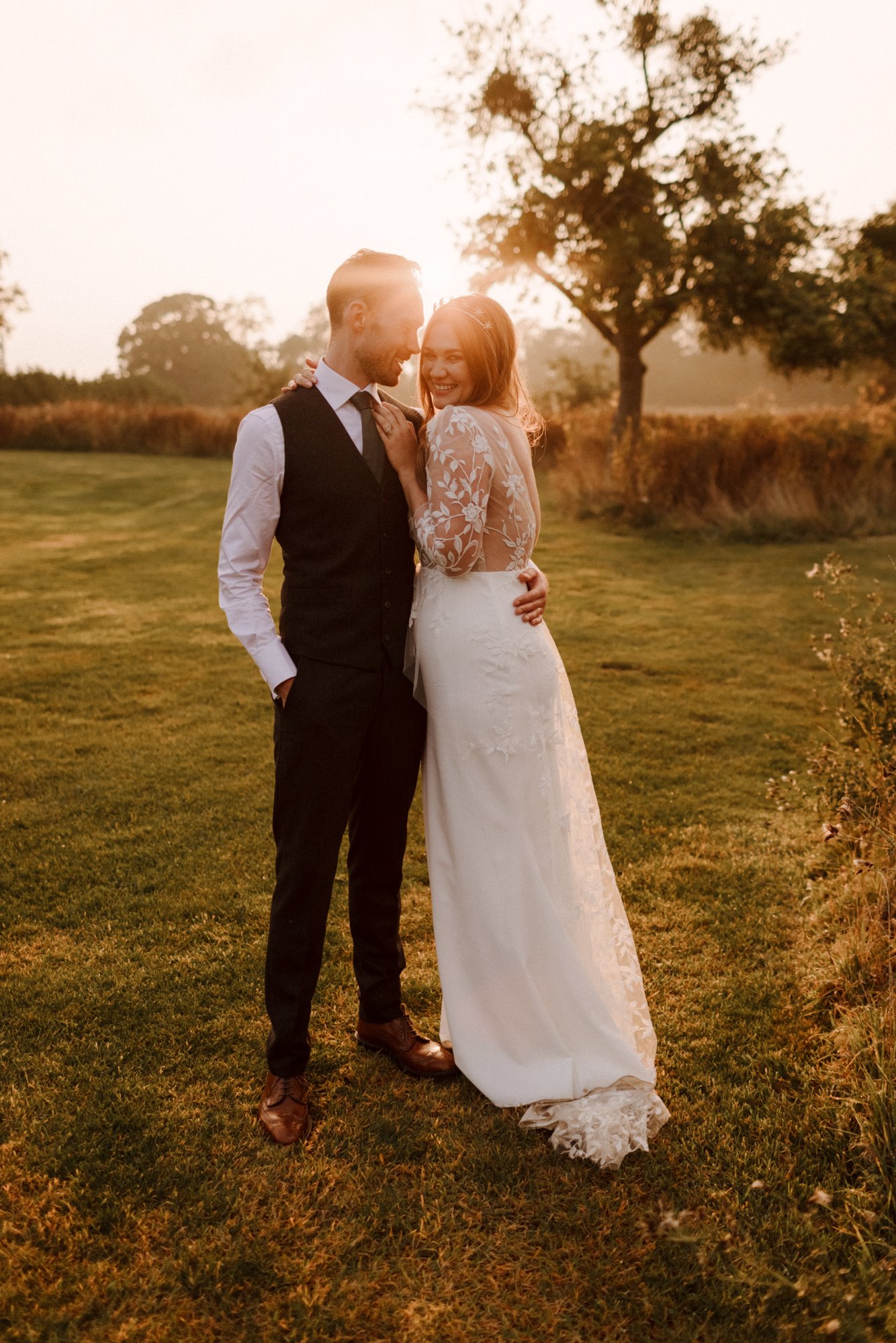 September wedding golden glow couple shots at sunset at this beautiful boho wedding in the countryside