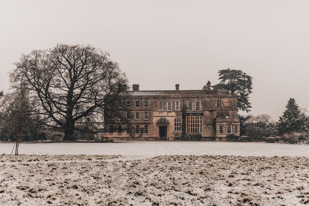 Snow on a wedding day at Cotswolds stately home elmore court