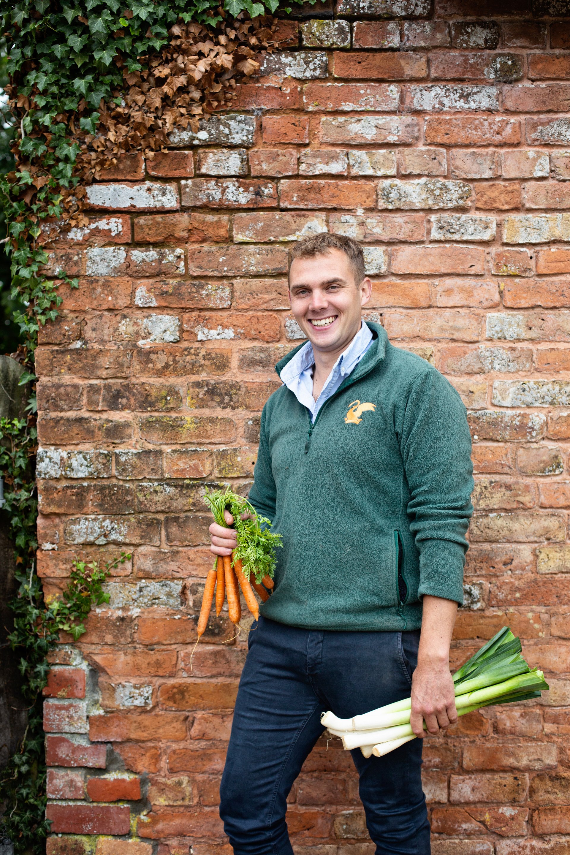 Head gardener Luke picking the first of the home grown produce at Elmore Court's revived Victorian walled garden