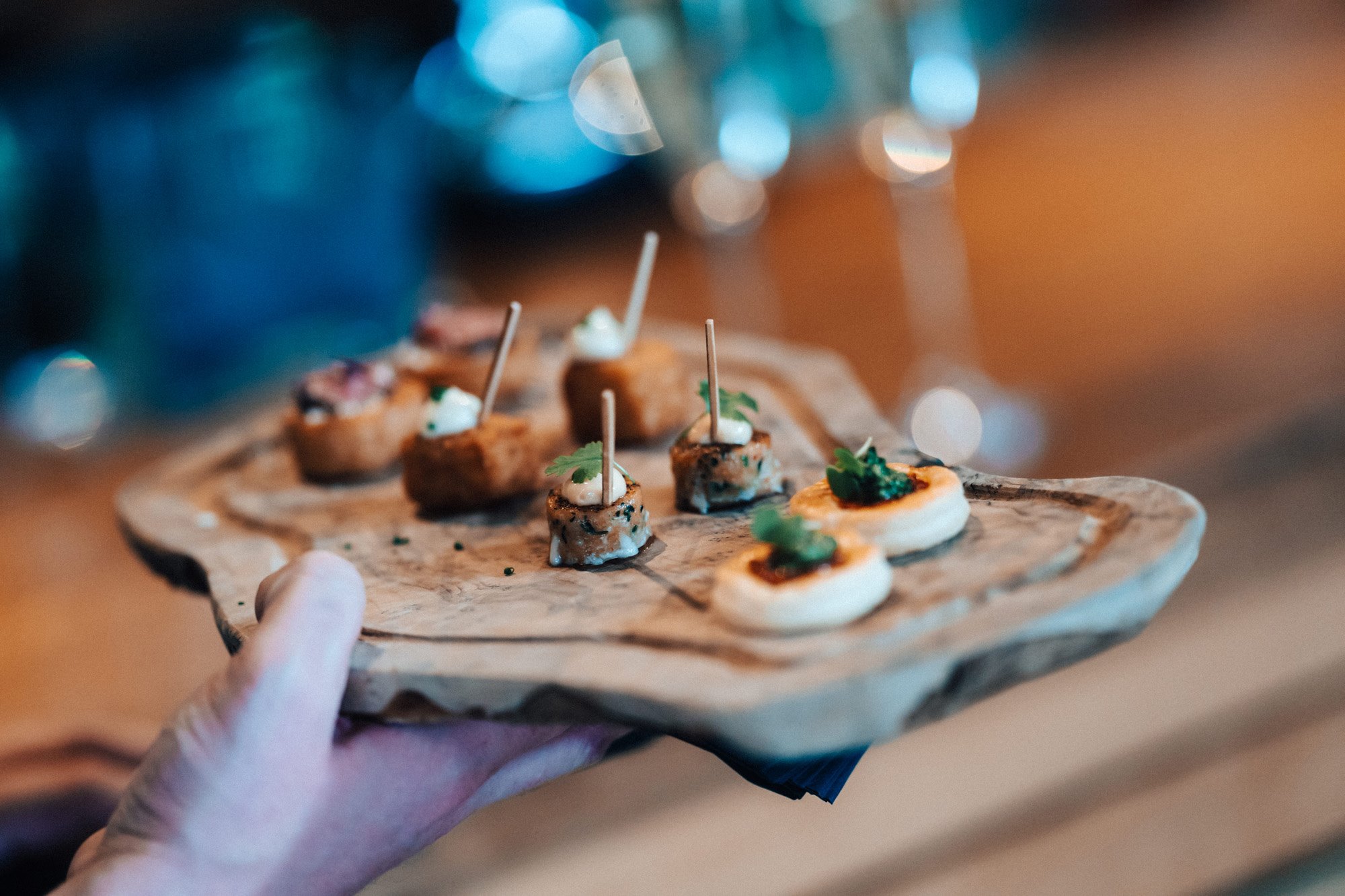 Autumn wedding canapes on a wooden board at a wedding at sustainable wedding venue in october