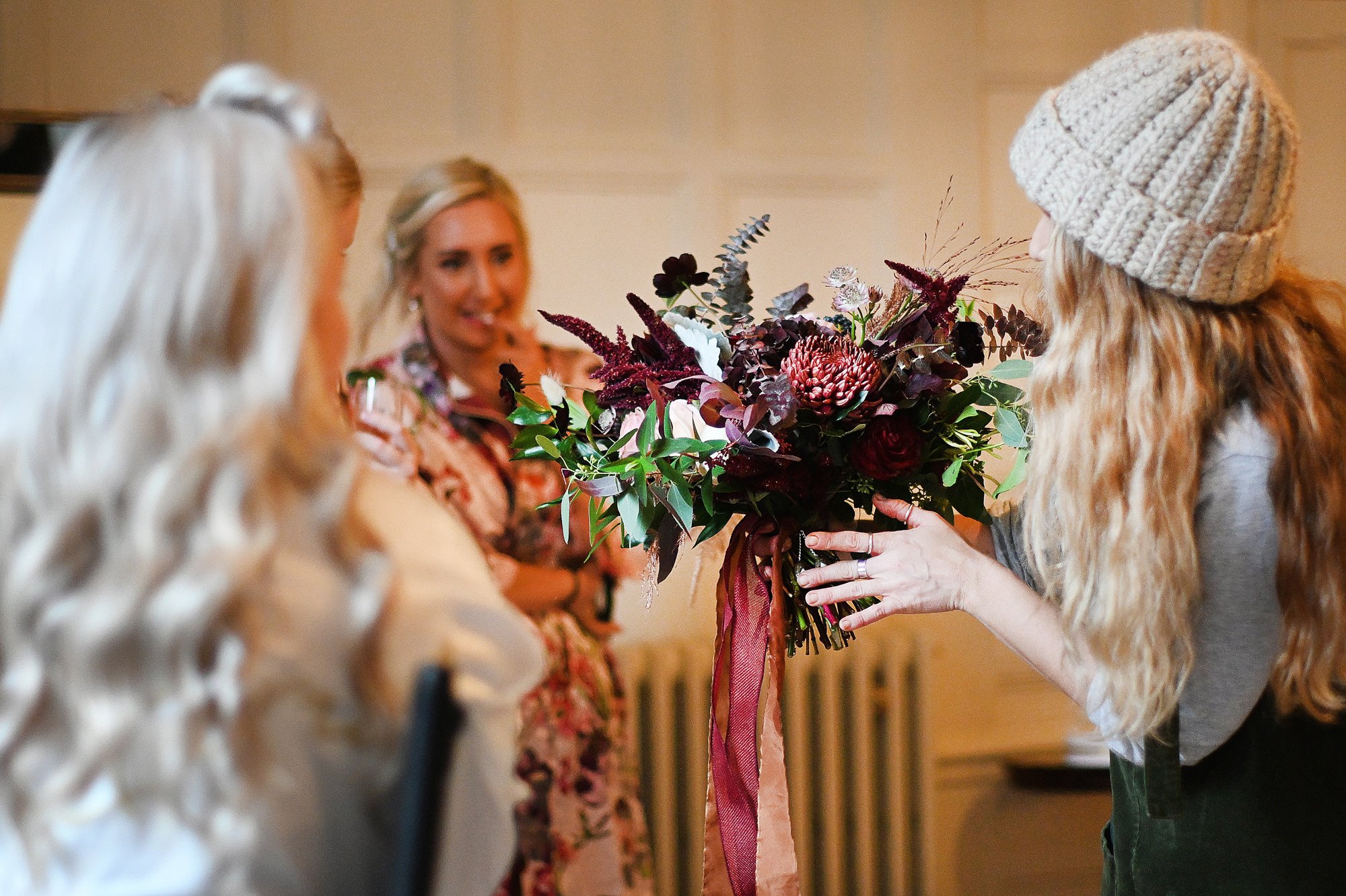 Autumn wedding flowers being delivered by florist for October wedding with halloween theme at stately home venue