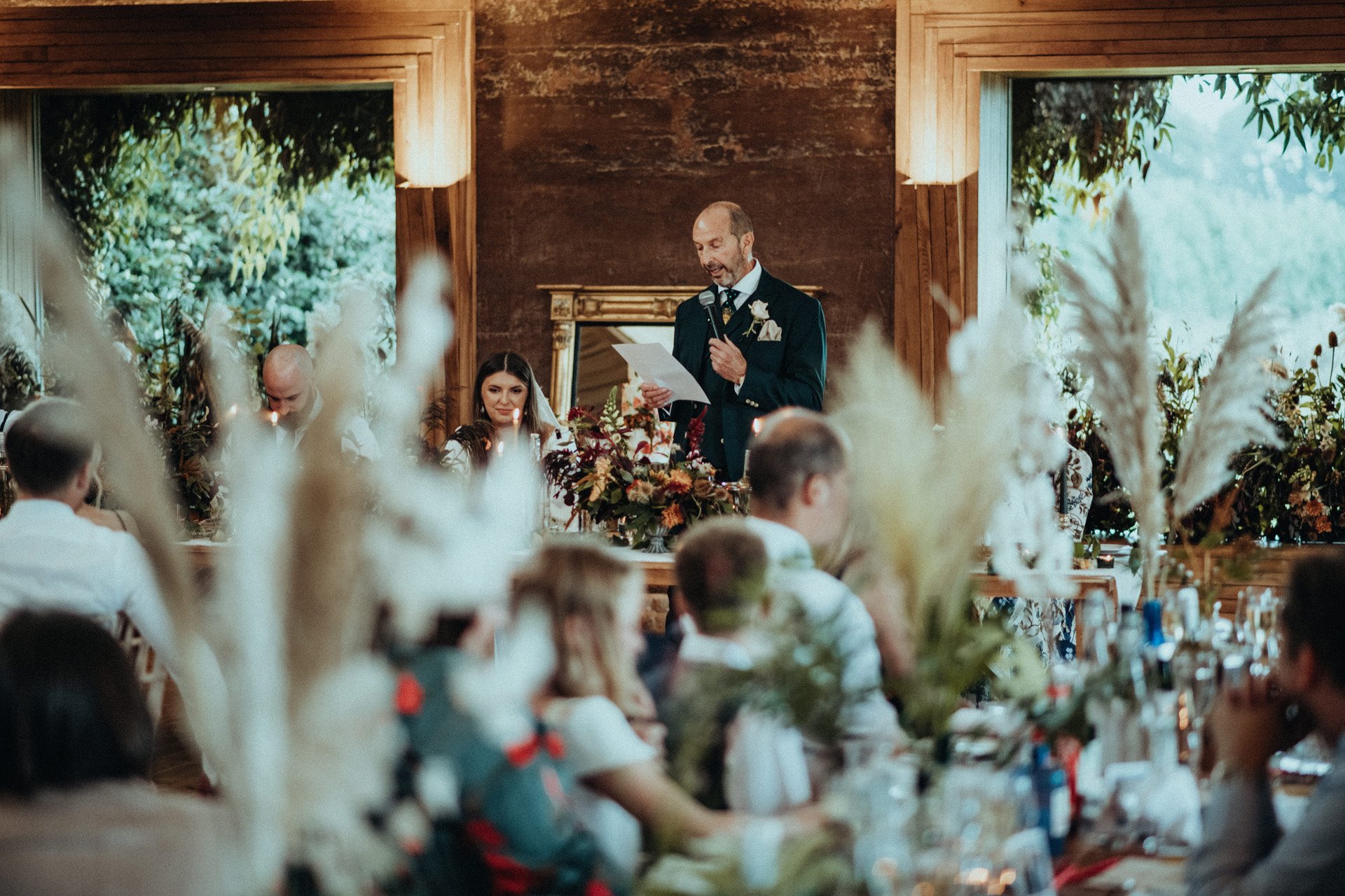 Rustic romantic wedding reception in rammed earth eco venue