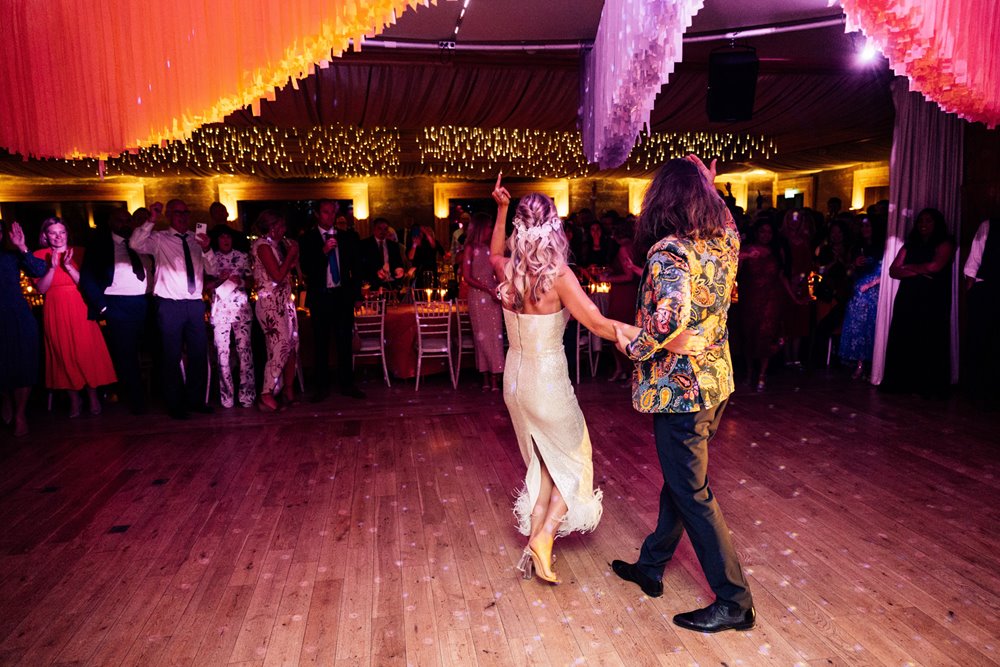 unique party wedding with bright streamers for a fun couple