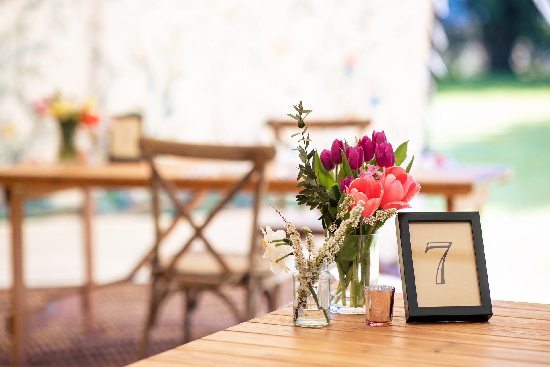 outdoor wedding dining with spring flowers on tables